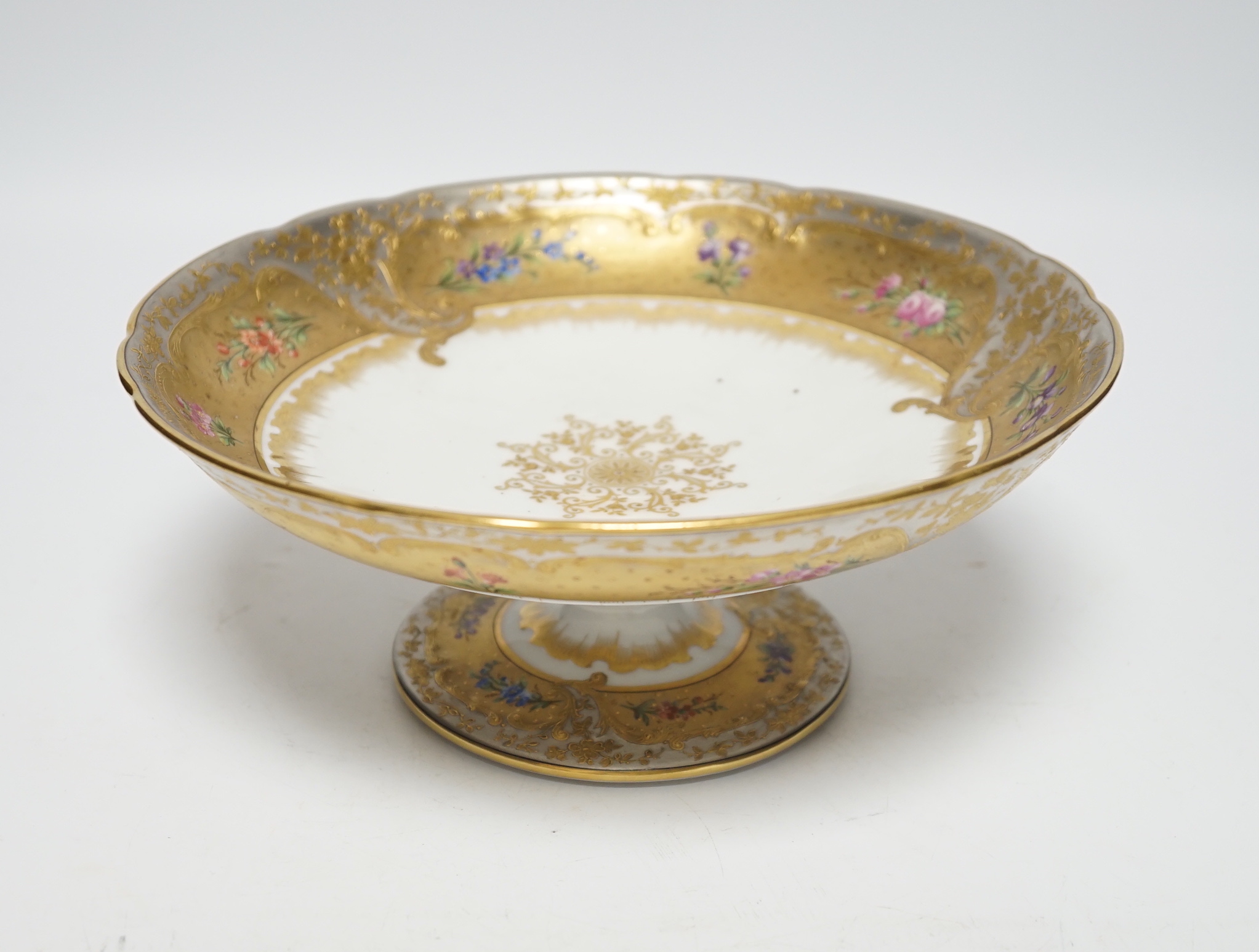 A late 19th Ernst Wahliss Vienna eighteen piece porcelain floral dessert service and a plate carrier, largest pieces 22cm in diameter